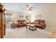 Comfortable living room with plush carpeting, stylish furnishings, and natural light at 12495 Sw 66Th St, Ocala, FL 34481
