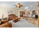 Inviting living room with modern furnishings and seamless transition to the kitchen area at 12495 Sw 66Th St, Ocala, FL 34481