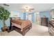 Main bedroom with ceiling fan and an ensuite bathroom at 12495 Sw 66Th St, Ocala, FL 34481