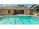 Enjoy a refreshing swim in this home's sparkling screened-in pool, complete with a spa at 12495 Sw 66Th St, Ocala, FL 34481