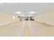 Spacious recreation room featuring an epoxy floor with court lines and ample space for various activities at 12495 Sw 66Th St, Ocala, FL 34481