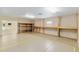 Large recreation room features built-in shelving and ample space for workshop activities at 12495 Sw 66Th St, Ocala, FL 34481