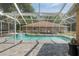 Enjoy this screened-in pool and spa area, perfect for outdoor relaxation and entertainment at 12495 Sw 66Th St, Ocala, FL 34481