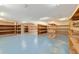 Spacious storage room featuring built-in wooden shelving units, offering ample organization options at 12495 Sw 66Th St, Ocala, FL 34481