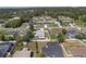 Aerial view shows this home's location in a residential community near mature trees and other homes at 14055 Sw 30Th Terrace Rd, Ocala, FL 34473