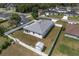 Aerial view of home with white fence, storage shed and green backyard at 14055 Sw 30Th Terrace Rd, Ocala, FL 34473