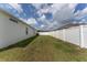 Fenced backyard with green lawn, offering privacy and space at 14055 Sw 30Th Terrace Rd, Ocala, FL 34473