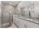 Bathroom boasts a glass-enclosed shower and a double vanity with granite countertops at 14055 Sw 30Th Terrace Rd, Ocala, FL 34473