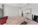 Bright bedroom featuring a floral-patterned comforter and a mirrored dresser at 14055 Sw 30Th Terrace Rd, Ocala, FL 34473