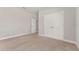 Spacious bedroom with carpet flooring, neutral walls, and closet with double doors at 14055 Sw 30Th Terrace Rd, Ocala, FL 34473