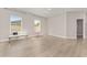 Spacious bedroom with light wood flooring, neutral walls, and abundant natural light from two windows at 14055 Sw 30Th Terrace Rd, Ocala, FL 34473