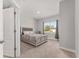 Bedroom with a window, carpeted floor, and comfortable bed at 14055 Sw 30Th Terrace Rd, Ocala, FL 34473