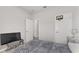 Bedroom featuring a bed with a blue comforter and a basketball hoop at 14055 Sw 30Th Terrace Rd, Ocala, FL 34473