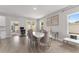 Dining room showing modern table set, connecting to the kitchen and outdoor patio at 14055 Sw 30Th Terrace Rd, Ocala, FL 34473