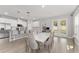 Bright dining area connecting to the kitchen, featuring a white table set and patio access at 14055 Sw 30Th Terrace Rd, Ocala, FL 34473