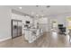 Modern kitchen with stainless steel appliances, granite countertops, and a large center island with bar seating at 14055 Sw 30Th Terrace Rd, Ocala, FL 34473