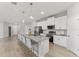 A large kitchen island is the centerpiece of this kitchen with seating for the whole Gathering at 14055 Sw 30Th Terrace Rd, Ocala, FL 34473