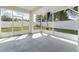 Relaxing screened lanai offering a peaceful view of the fenced backyard at 14055 Sw 30Th Terrace Rd, Ocala, FL 34473