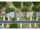 Aerial view of neighborhood showcasing property, mature trees, and well-maintained lawns at 14481 Sw 112Th Cir, Dunnellon, FL 34432