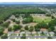 Community aerial view with golf course, surrounding the properties and large expanses of forest land at 14481 Sw 112Th Cir, Dunnellon, FL 34432