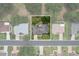 Aerial view of home showcasing the surrounding neighborhood, lush greenery, and well-maintained streets at 14481 Sw 112Th Cir, Dunnellon, FL 34432