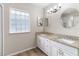 Bright bathroom with double sinks, granite countertop and modern fixtures at 14481 Sw 112Th Cir, Dunnellon, FL 34432