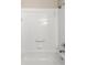 Shower and tub combination with white tiled walls and chrome fixtures at 14481 Sw 112Th Cir, Dunnellon, FL 34432
