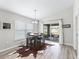 Bright dining room with natural light and sliding door access to the backyard patio at 16192 Se 104Th Ter, Summerfield, FL 34491