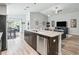 Spacious kitchen island overlooks living room, perfect for entertaining and casual dining at 16192 Se 104Th Ter, Summerfield, FL 34491