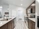 Kitchen features stainless steel appliances, granite countertops, and wood cabinets at 16192 Se 104Th Ter, Summerfield, FL 34491