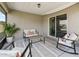 Inviting screened lanai with comfortable seating, a rug, and a serene outdoor ambiance at 16192 Se 104Th Ter, Summerfield, FL 34491