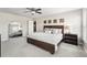 Cozy primary bedroom features soft carpet, a ceiling fan, and a mirrored accent wall at 16192 Se 104Th Ter, Summerfield, FL 34491