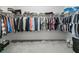 Spacious walk-in closet featuring ample shelving and hanging space for organized storage solutions at 16192 Se 104Th Ter, Summerfield, FL 34491