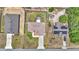 A bird's eye view shows a home with an enclosed porch, surrounded by a well-kept lawn at 16969 Sw 40Th Cir, Ocala, FL 34473