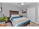 Cozy bedroom with warm tones, a ceiling fan, and light wood flooring at 16969 Sw 40Th Cir, Ocala, FL 34473