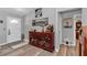 Welcoming foyer featuring a decorative cabinet and tasteful wall art at 16969 Sw 40Th Cir, Ocala, FL 34473