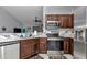 Modern kitchen showcasing stainless steel appliances and elegant marble countertops for a sleek look at 16969 Sw 40Th Cir, Ocala, FL 34473