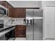 Updated kitchen featuring stainless steel appliances and stylish marble backsplash, blending form and function at 16969 Sw 40Th Cir, Ocala, FL 34473