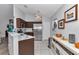 Well-lit kitchen featuring stainless steel appliances and marble countertops, perfect for culinary enthusiasts at 16969 Sw 40Th Cir, Ocala, FL 34473