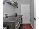 Bright laundry room with a modern washer and dryer and ample storage shelving at 16969 Sw 40Th Cir, Ocala, FL 34473