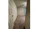 This bedroom features neutral walls, standard closet and carpeted floors at 24 Malauka Ter, Ocklawaha, FL 32179