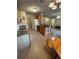 Functional kitchen with tiled flooring, sink with window and bar stool seating at 24 Malauka Ter, Ocklawaha, FL 32179
