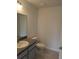 Well-lit bathroom with modern vanity, toilet, and tiled flooring at 2825 Sw 147Th Ct, Ocala, FL 34481