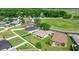 Aerial view of the rear of single-Gathering homes with manicured lawns and white fencing at 4225 Sw 57Th Ave, Ocala, FL 34474
