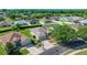 Aerial view showcasing a home's landscaping and neighborhood in a quiet community at 4225 Sw 57Th Ave, Ocala, FL 34474