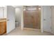 Ceramic-tile bathroom featuring a glass-enclosed shower, vanity, and toilet at 4225 Sw 57Th Ave, Ocala, FL 34474