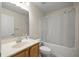 Well-lit bathroom with a tub and shower combo, single sink vanity and toilet at 4225 Sw 57Th Ave, Ocala, FL 34474
