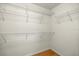 Walk-in closet with wooden floors and white metal shelving at 4225 Sw 57Th Ave, Ocala, FL 34474