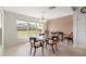 Bright dining area with a glass top table, tile floors, and large windows that offer abundant natural light at 4225 Sw 57Th Ave, Ocala, FL 34474