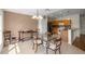 Comfortable dining area with a glass top table, tile floors, seamlessly connecting to the kitchen at 4225 Sw 57Th Ave, Ocala, FL 34474